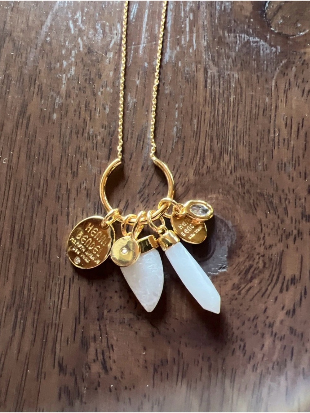 henri bendel Gold Necklace with White Crystal Points and Charms